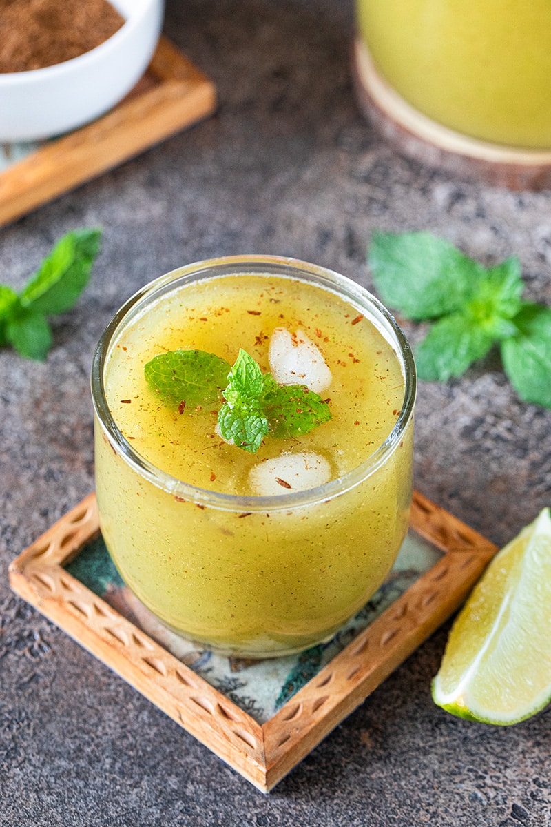 Summer coolant - Aam panna in a glass served with ice and fresh mint leaves