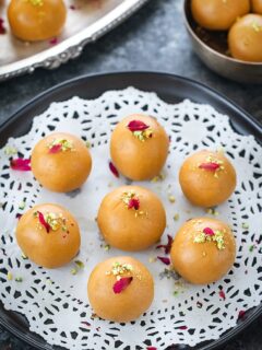Besan ladoo garnished with rose petals