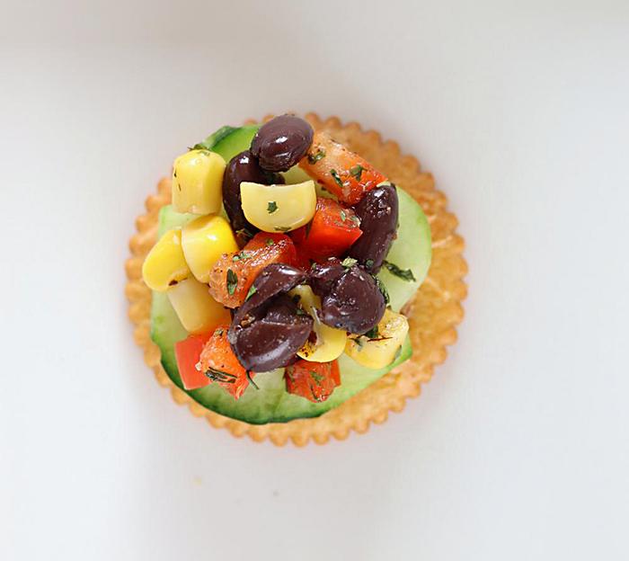 Ritz cracker topped with salsa