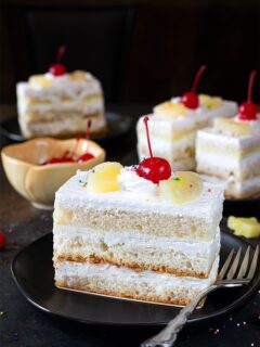 Layered eggless Pineapple pastry topped with cherry