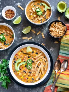 Instant Pot Creamy Chicken Tortilla Soup garnished with avocados and tortilla strips