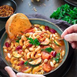 Instant Pot Minestrone soup with a slice of bread
