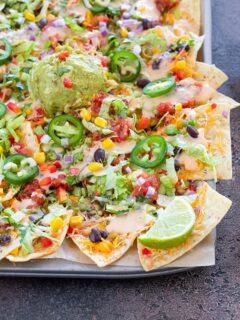 Loaded vegetable Nachos on a sheet pan