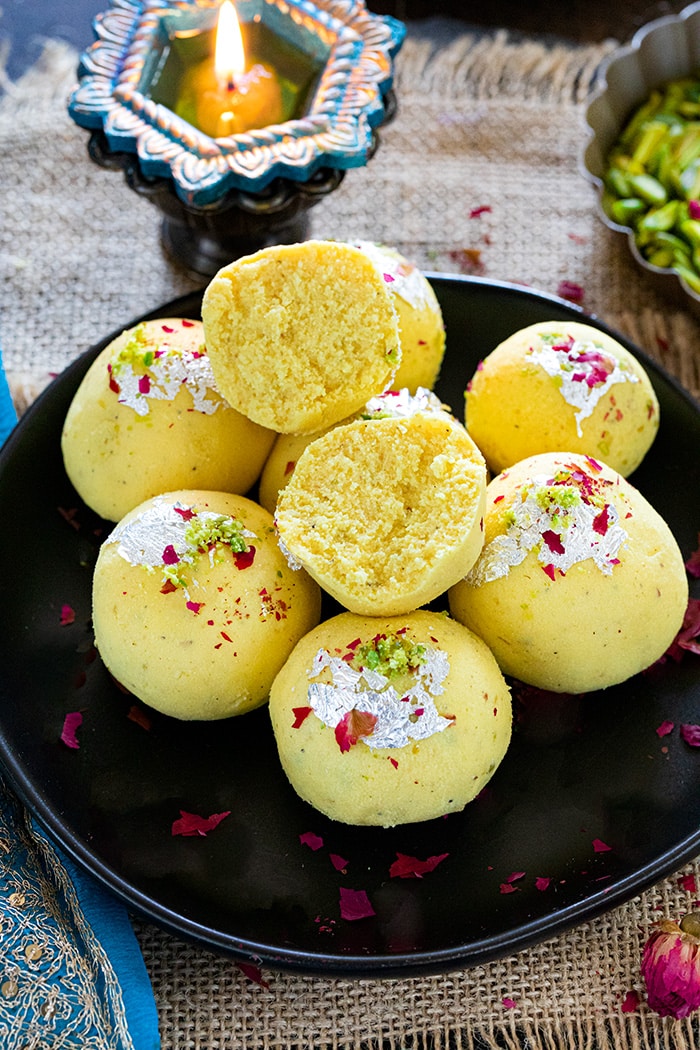 Paneer Malai Ladoo  on a plate garnished with rose leaves