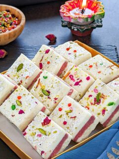 Gulkand Burfi Sandwich stacked in a tray