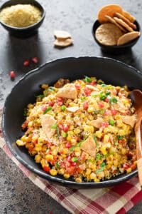 Spicy Masala Corn Chaat garnished with cilantro